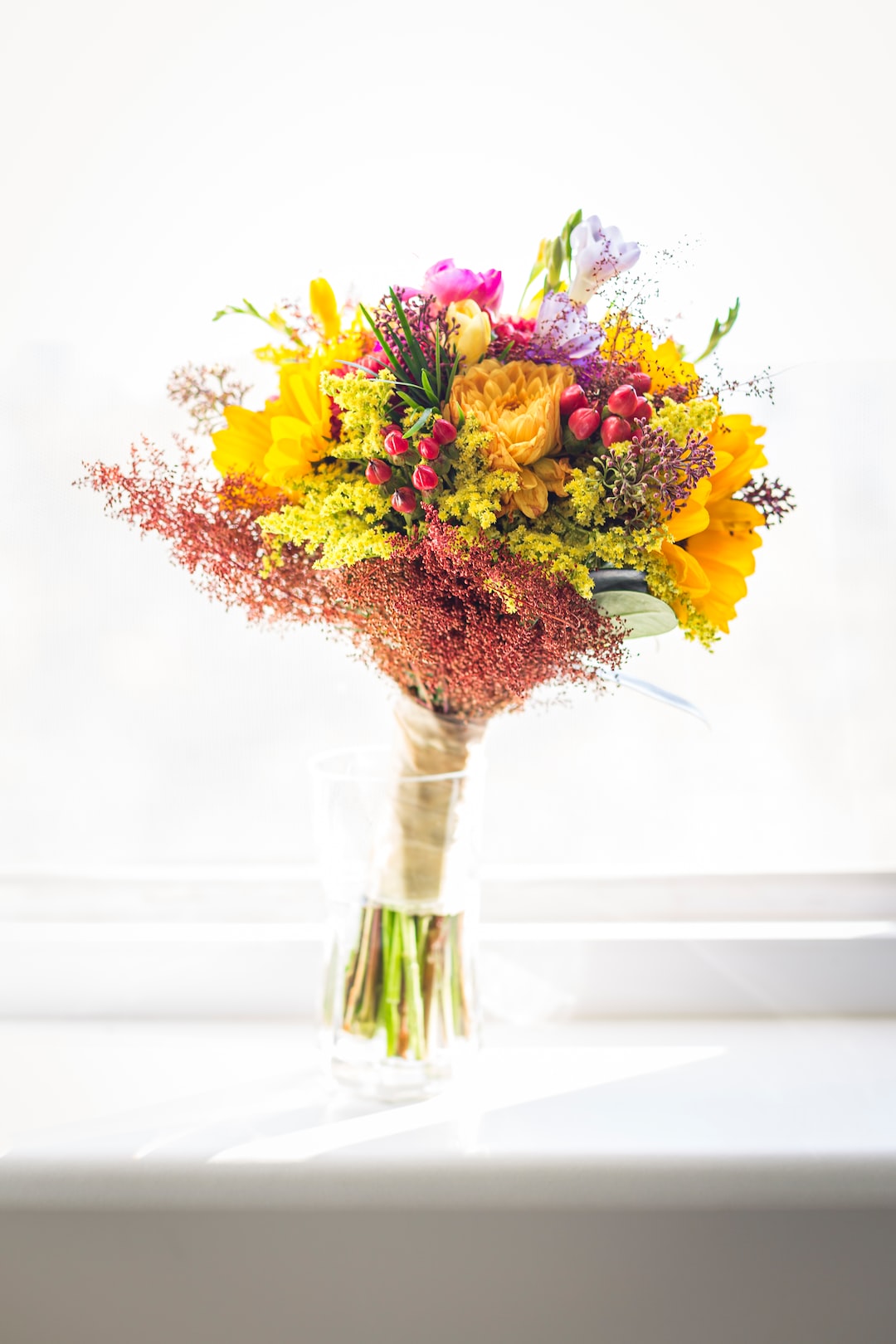 assorted-color flowers on vase